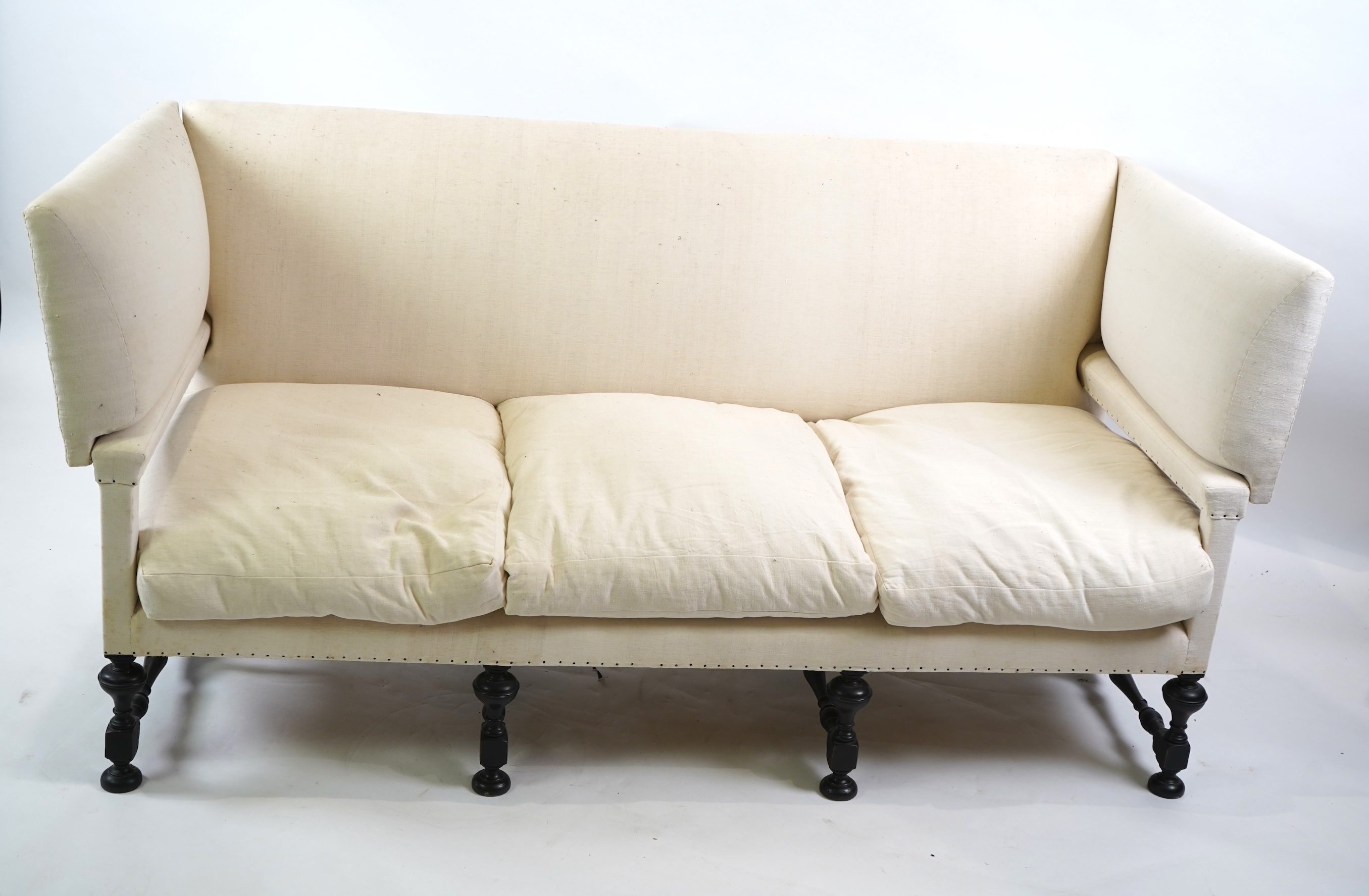 A Jacobean revival Knowle type three seater sofa